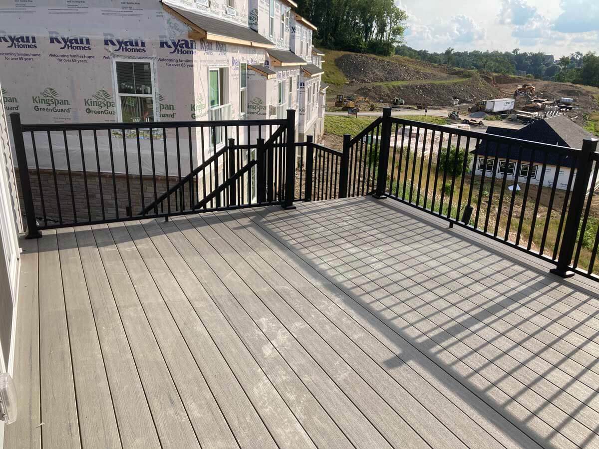 Wood deck with aluminum railings installed in Western Pennsylvania on the side of a home