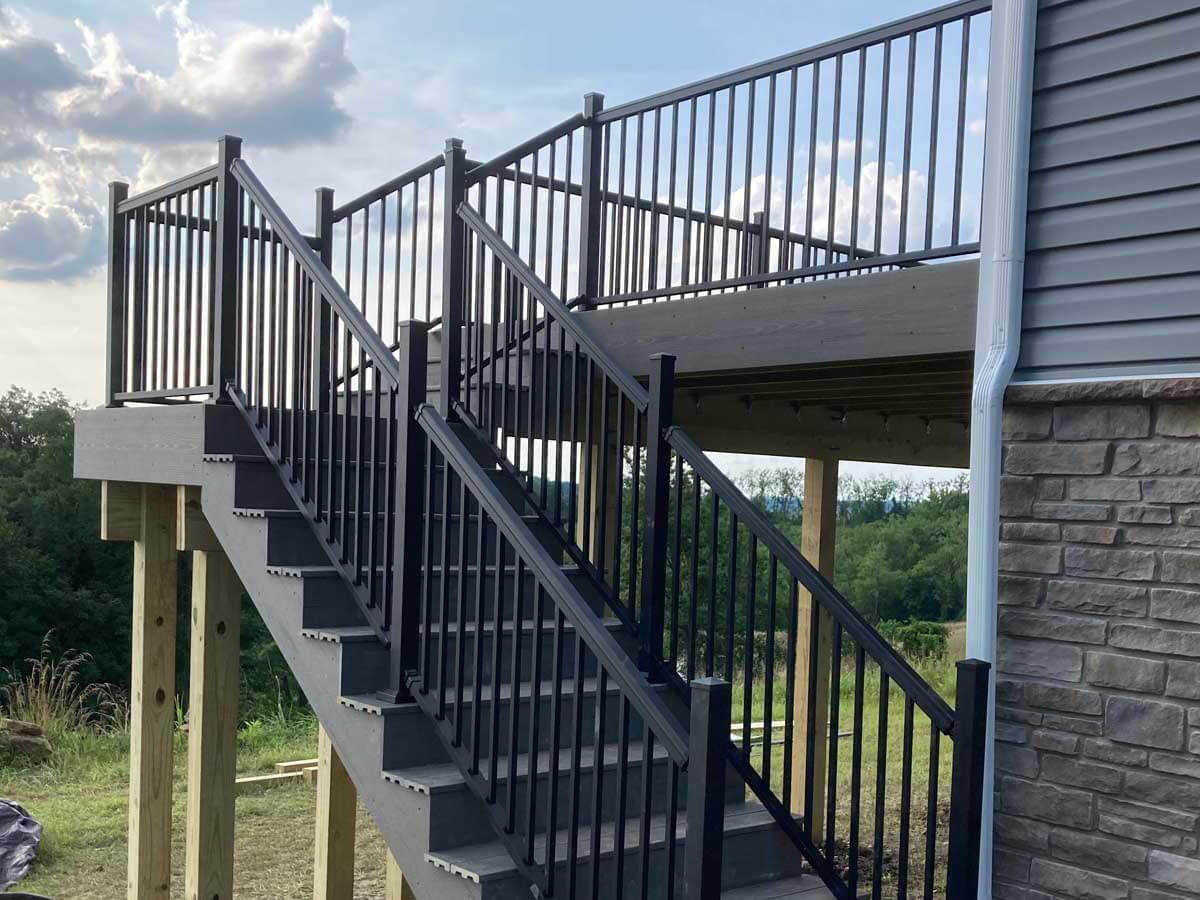 Dark wood deck with aluminum railings and staircase installed in Western Pennsylvania