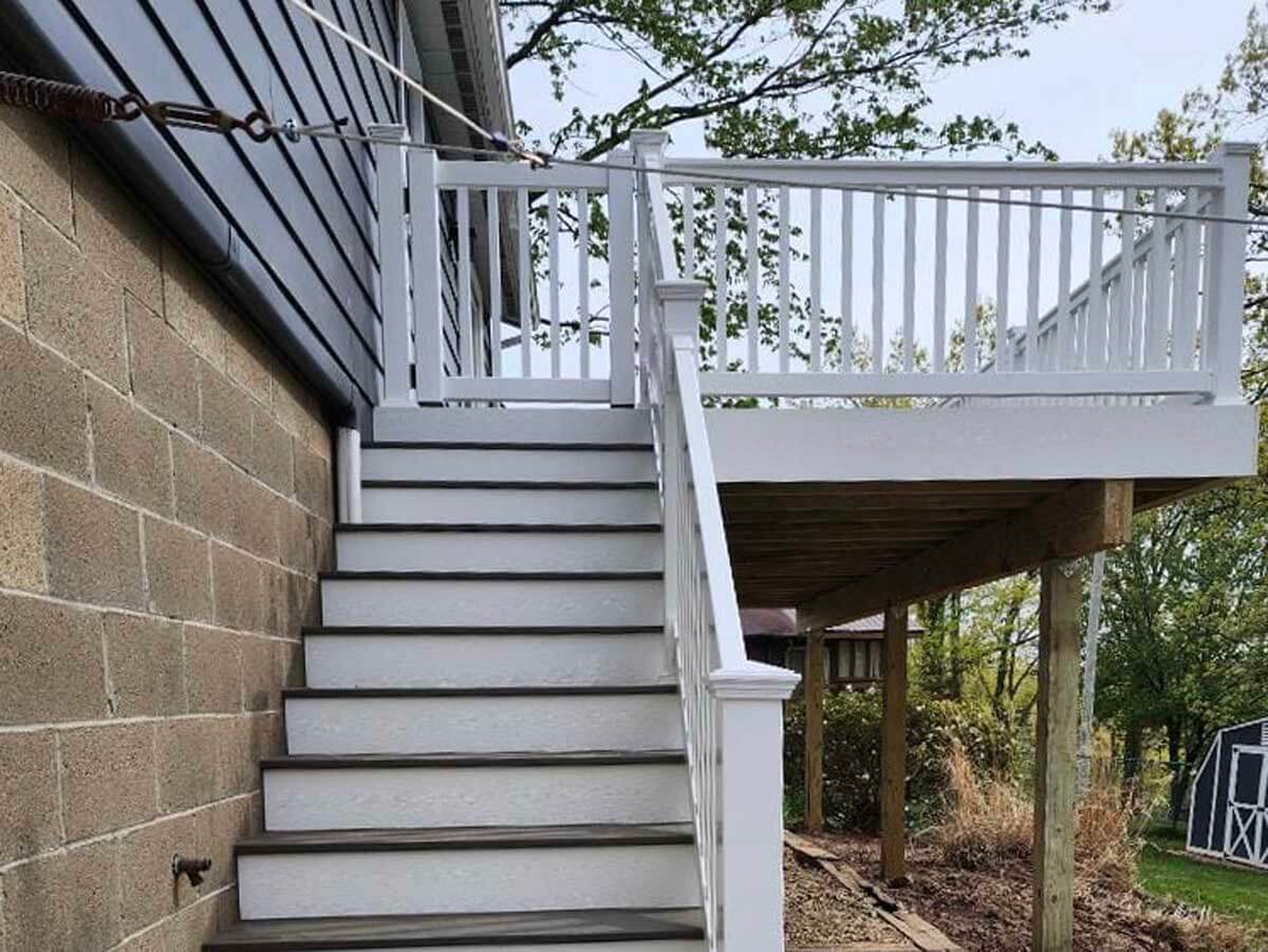 Second Story Deck with vinyl railings installed in Ohio on the side of a residential property