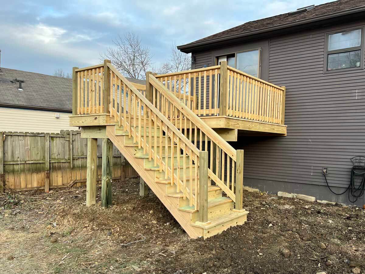 Wood deck and railings with stairs installed for a residential homes second floor in Western PA